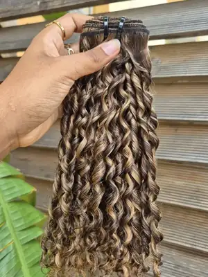 Dark brown pixel curl weave with blonde highlights