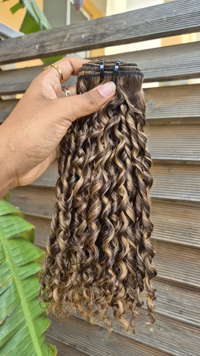 Dark brown pixel curl weave with blonde highlights